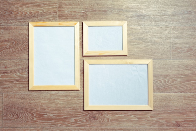  photo frames on the wooden wall