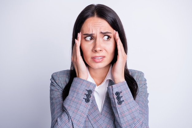 Photo frightened horrified collar woman agent touch hands forehead look copyspace worry coronavirus crisis staff company dismissal wear checkered plaid suit isolated grey color background