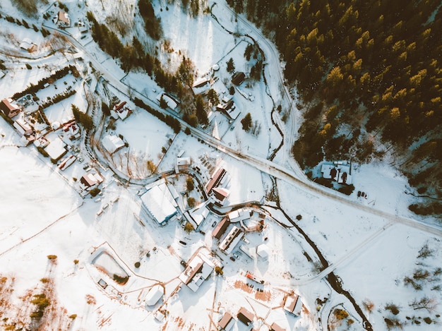 Photo from above of little houses in mountains village