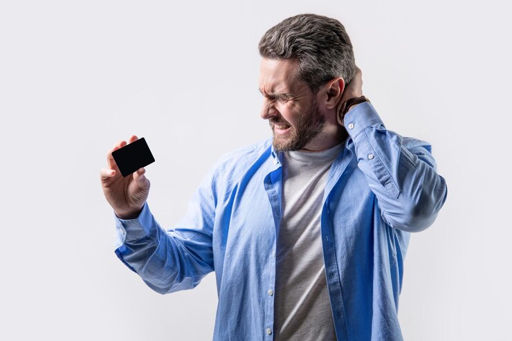 Photo photo of frustrated guy hold business credit guy show business credit isolated on studio