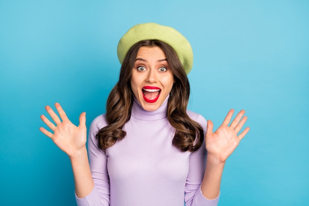Photo of funky traveler lady toothy beaming smiling open mouth excited feelings wear green beret hat purple turtleneck isolated bright blue color wall