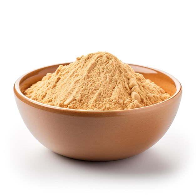 Photo photo of ginger powder in minimalist brown bowl isolated on white background