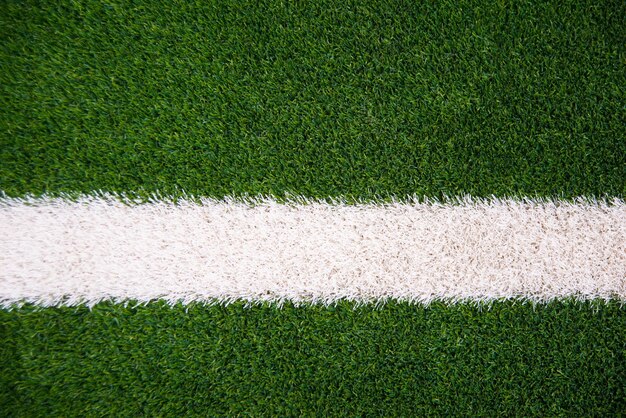 Photo photo of green grass and white line on football stadium