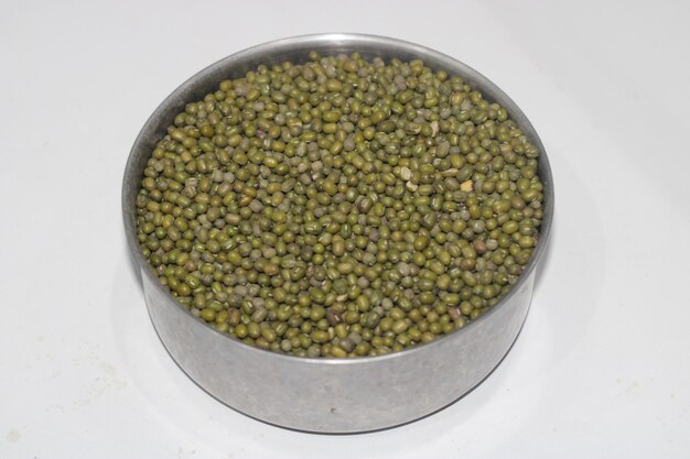 Photo Of Green Nuts On An Iron Container