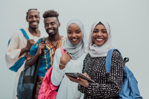 Photo of a group of happy african students talking and meeting together working on homework girls we