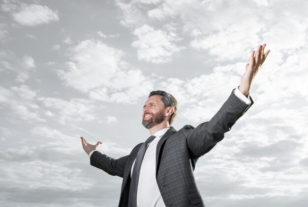 Photo of happy ceo in suit ceo in suit on sky background ceo in suit outdoor ceo in business suit