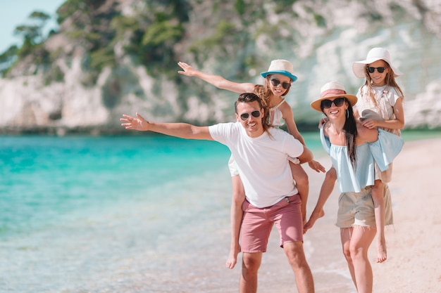 Photo of happy family having fun on the beach. Summer Lifestyle