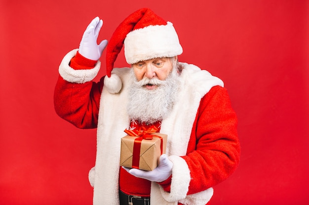 Photo of happy Santa Claus with present gift boxes