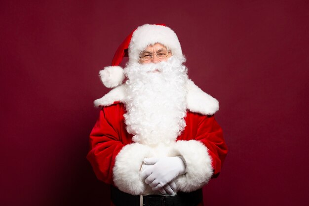 Photo of happy smiling Santa Claus is posing 