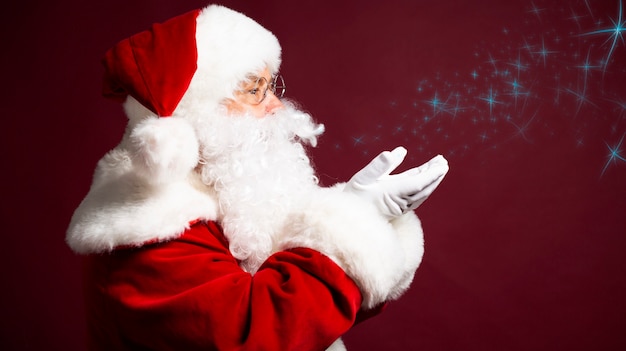 Photo of happy smiling Santa Claus is posing 