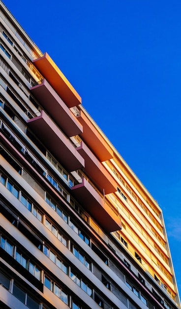 Photo of a highrise building with balconies during daytime photo