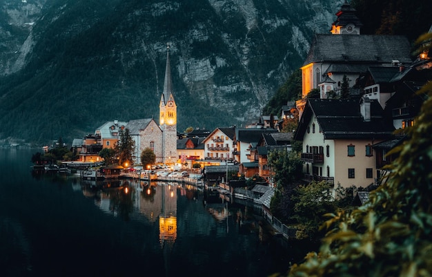 Photo of houses near beautiful lake at night