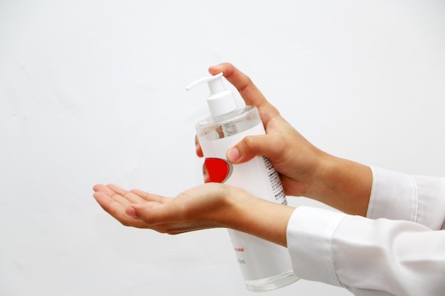 photo illustration of people's hands using hand sanitizer