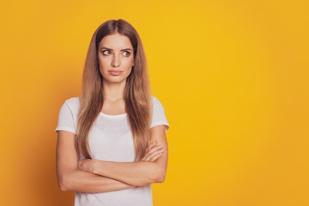 Photo of lady with arms crossed isolated yellow background