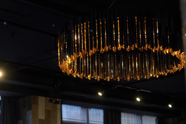 Photo of large metal chandelier with plates Ceiling lighting Light in cafes and restaurants
