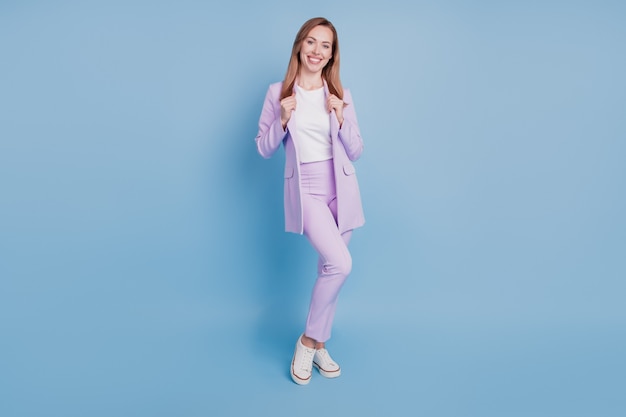 Photo of lovely boss girl touch blazer isolated over blue background