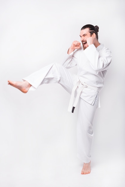 Photo of man practicing taekwondo and making a kick with leg