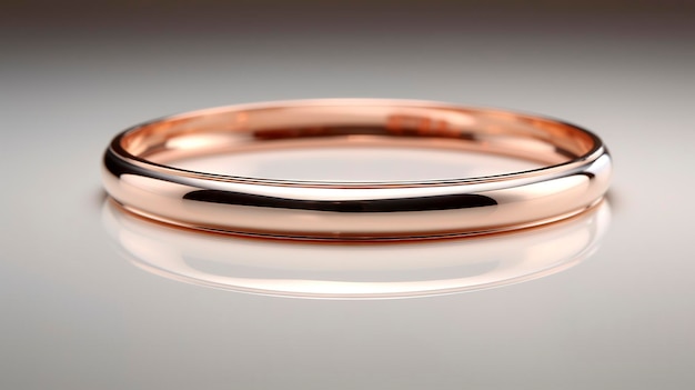 A photo of a minimalist rose gold bangle