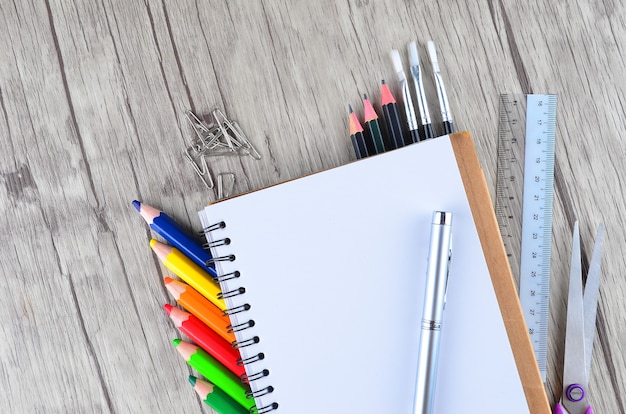 Photo of office and student gear over white background - Back to school concept