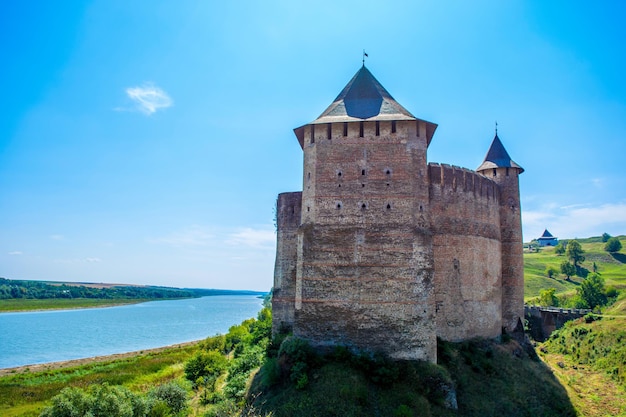 Photo of old ancient stone castle with many hight towers in Khotyn