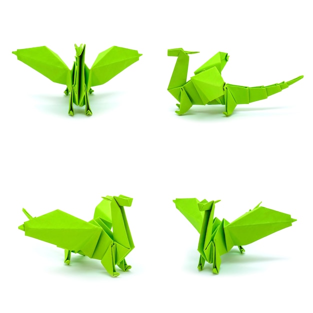 Фото зеленых драконов оригами на белом фоне