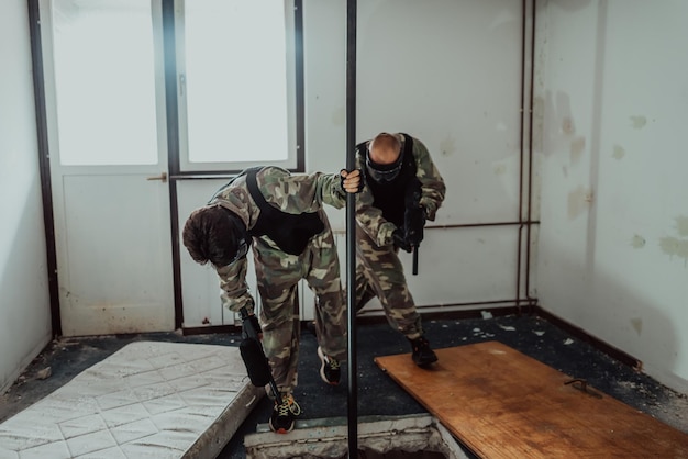 Photo of a paintball player in action with professional equipmentselective focus