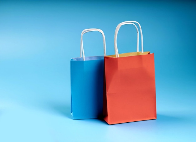 Photo paper shopping bags on blue background