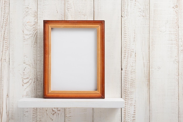 Photo picture frame at wooden shel