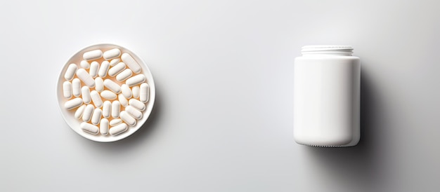 Photo of a pill and a bottle on a white surface with copy space with copy space