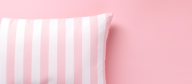 Photo photo of a pink and white striped pillow against a soft pink background with copy space