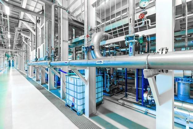 Photo of pipes and tanks chemistry and medicine production pharmaceutical factory interior of a
