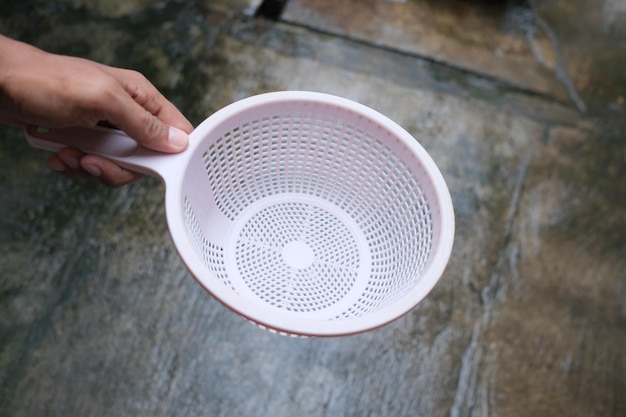 Photo of plastic tray in hand