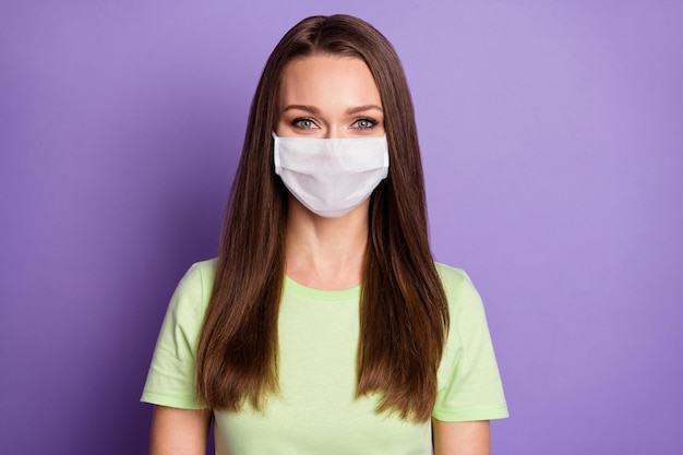 Photo portrait of girl wear medical mask covid-19 concept protection isolated on vivid purple colored background