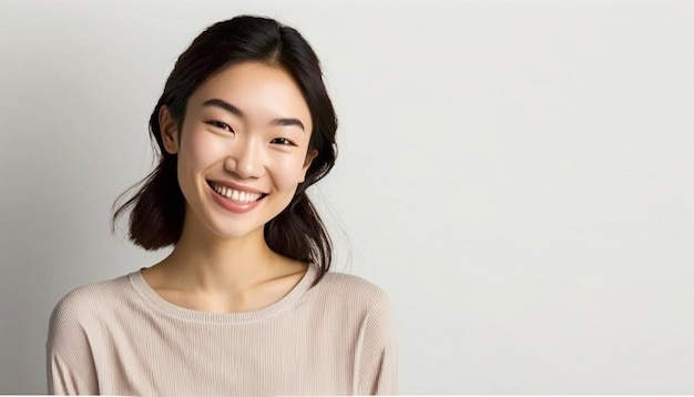 Photo portrait of young beautiful asian lady smiling with cheerful expression.