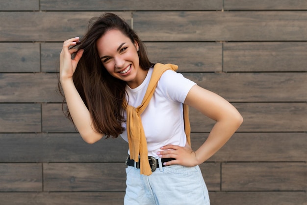 Photo of pretty attractive beautiful smiling happy positive charming young brunette young woman