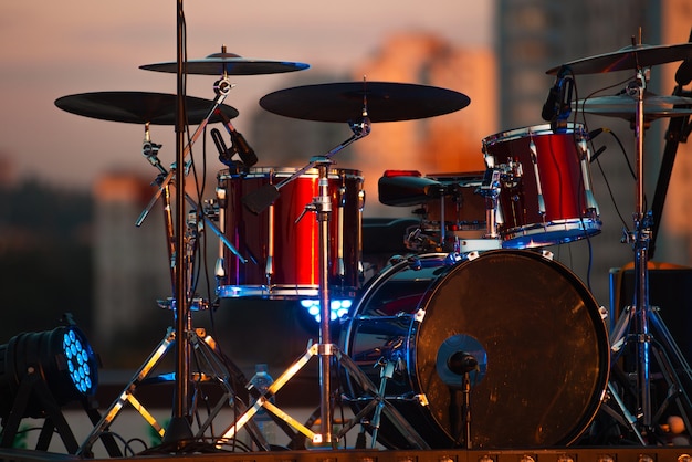 A photo of a red drum kit on stage