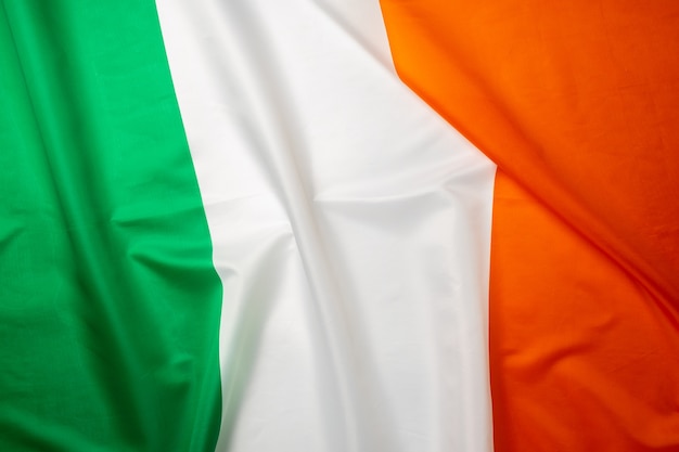 Photo of rippled national flag of Ireland close up