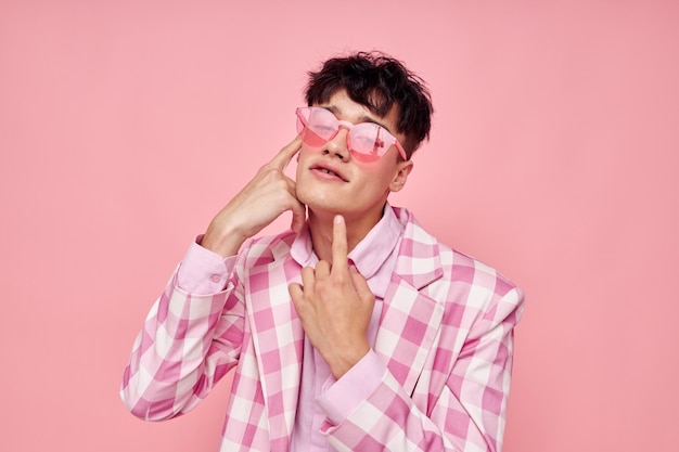 Photo of romantic young boyfriend pink glasses checkered jacket fashion posing pink background unaltered