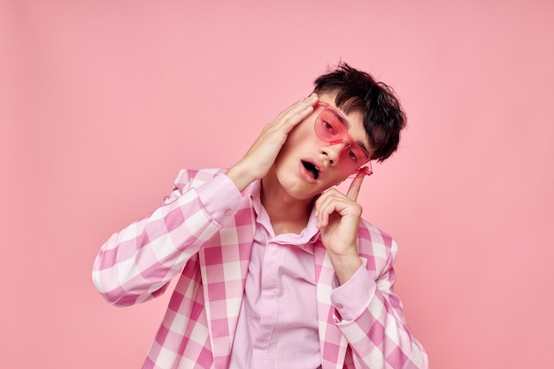 Photo of romantic young boyfriend pink glasses checkered jacket fashion posing pink background unaltered