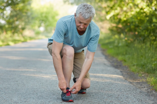 Photo of senior male has running exercise outdoor