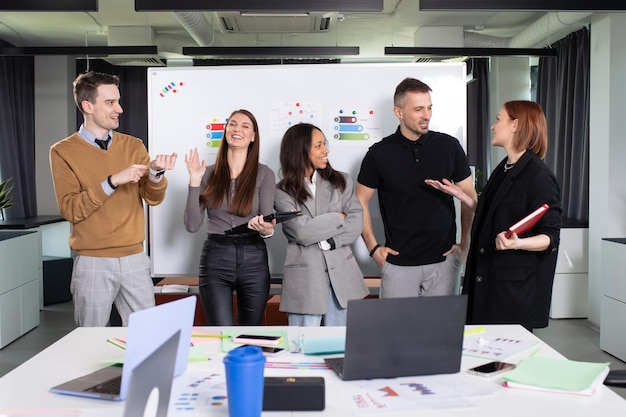 Photo session of the business startup team Five successful and smiling people