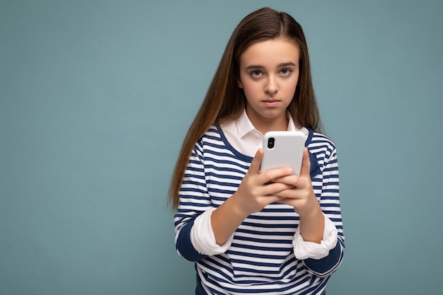 Photo shot of attractive upset sad good looking teenager wearing casual stylish outfit poising