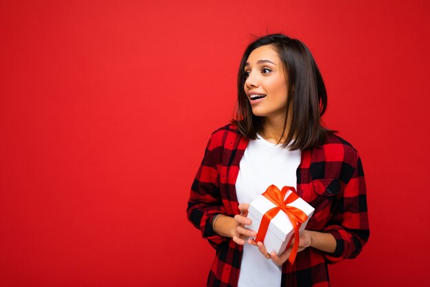 Photo shot of pretty positive young brunette woman