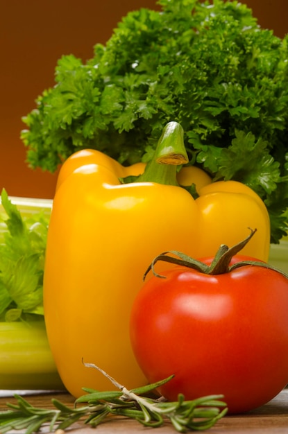 Photo of small cherry tomatoes on the table against the background of green