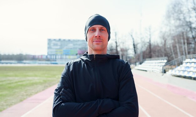 Photo of sporty man on street at stadium