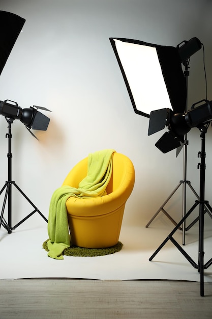 Photo studio with modern interior and lighting equipment