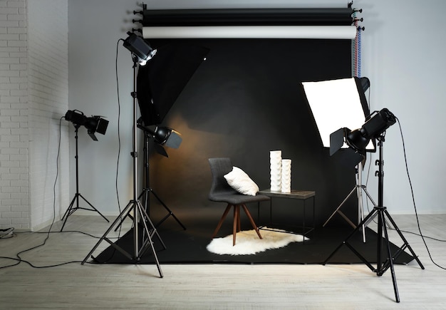 Photo studio with modern interior and lighting equipment