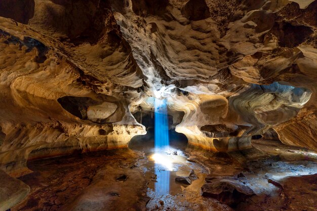 Photo of sunrays in a cave photo