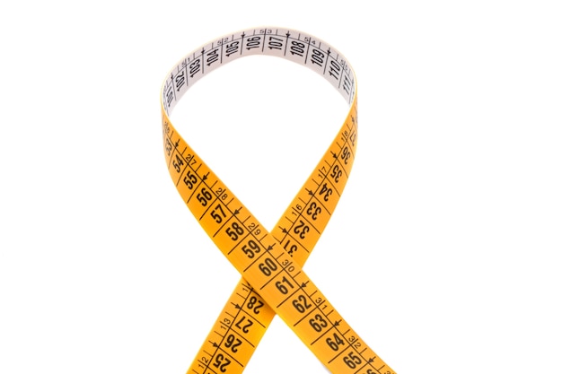 Photo photo of tape measure cross a over white background