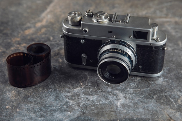 Photo tape and vintage camera on table